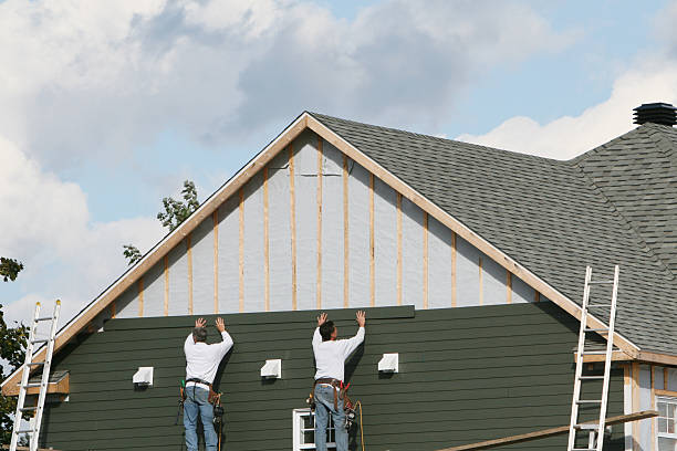Professional Siding Contractor technician working in Norwood, MA